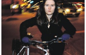 Cyclist dressed in black. Photograph by Mark van Manen, PNG.